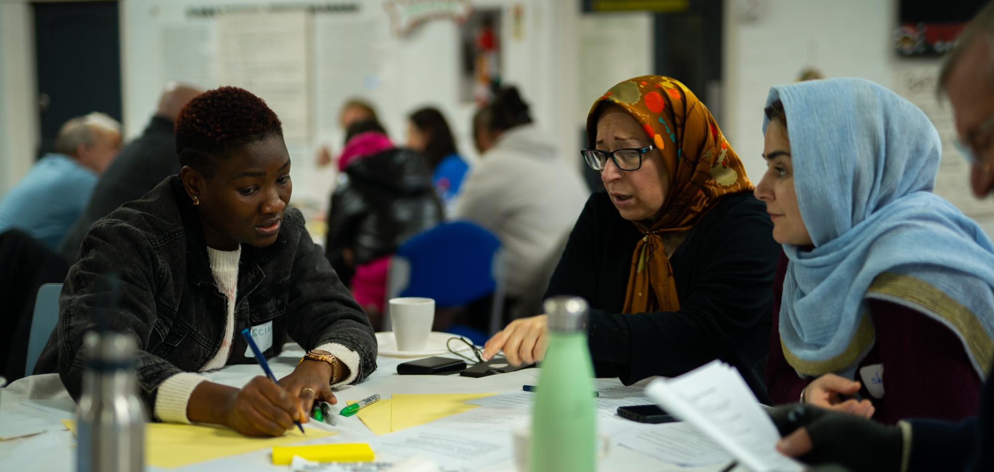A group of residents deliberating together