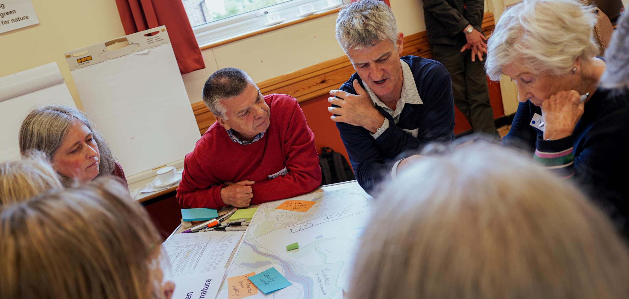 Wivenhoe residents discuss plans for local nature around a table
