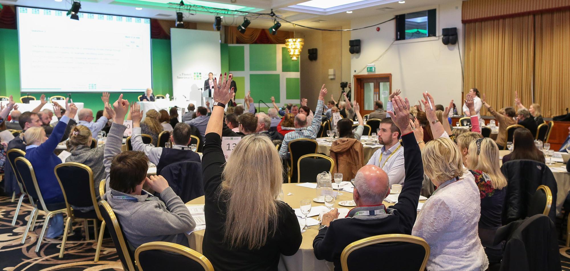 Ireland's Citizens Assembly. People in a room looking at screens and engaging in conversation. 