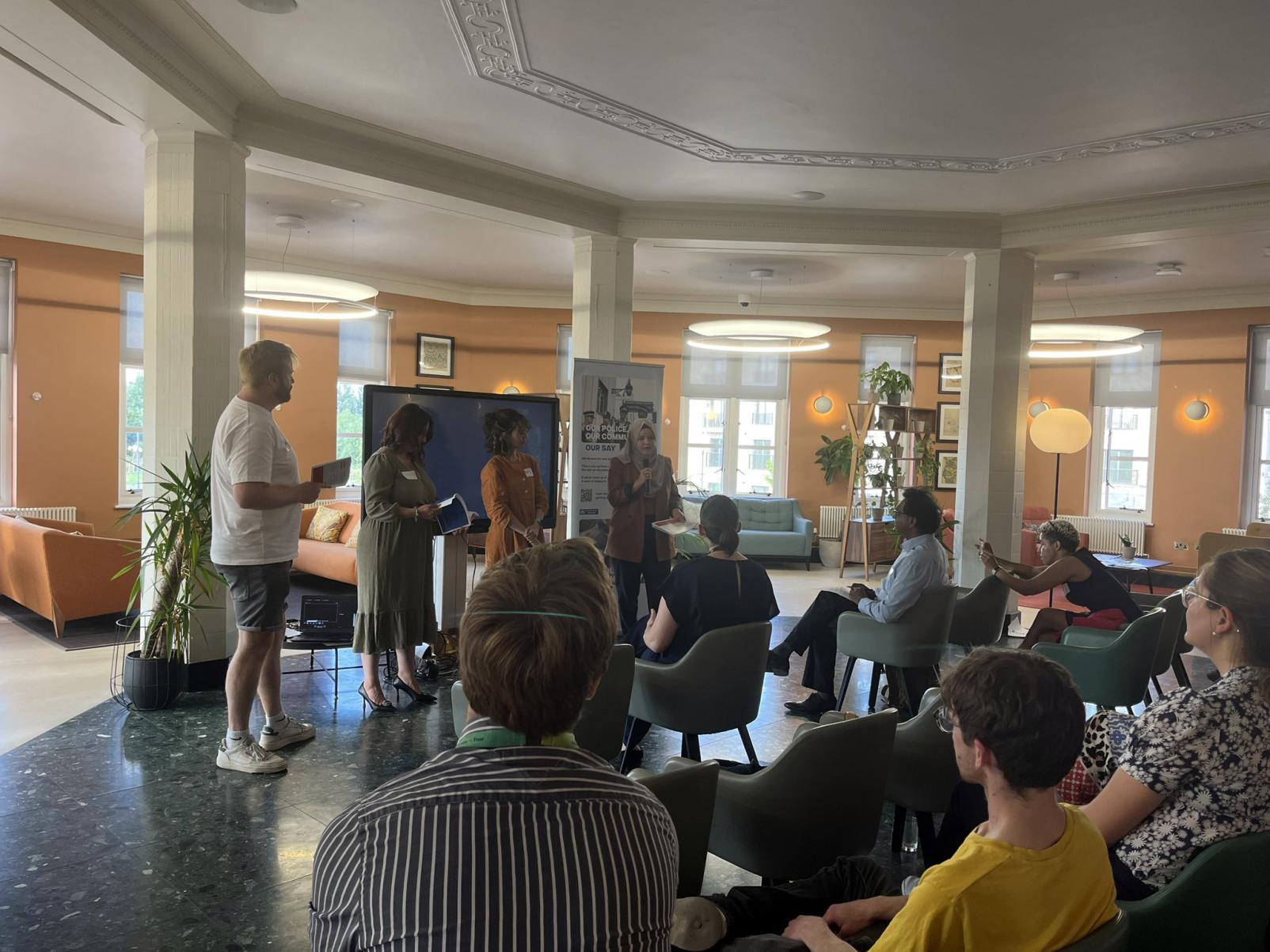 Image of people in a room talking