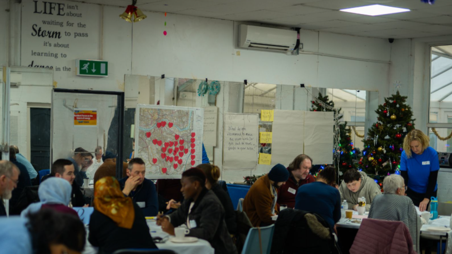 People working together in a room, talking