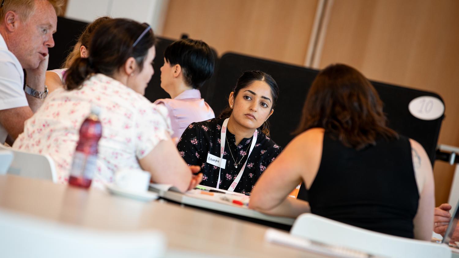 Image of local authority officers speaking around a table