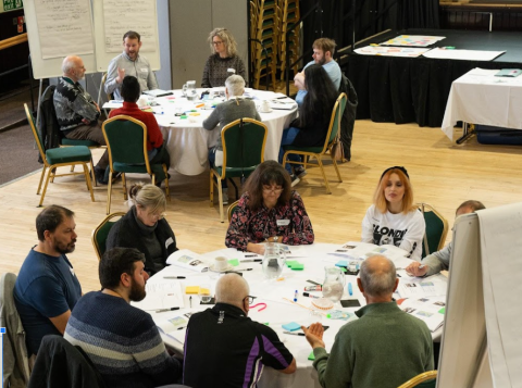 People sitting in a room talking